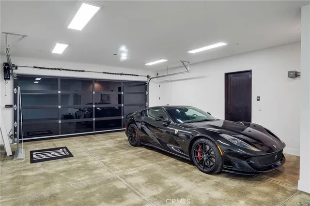 a living room with furniture a flat screen tv and a table