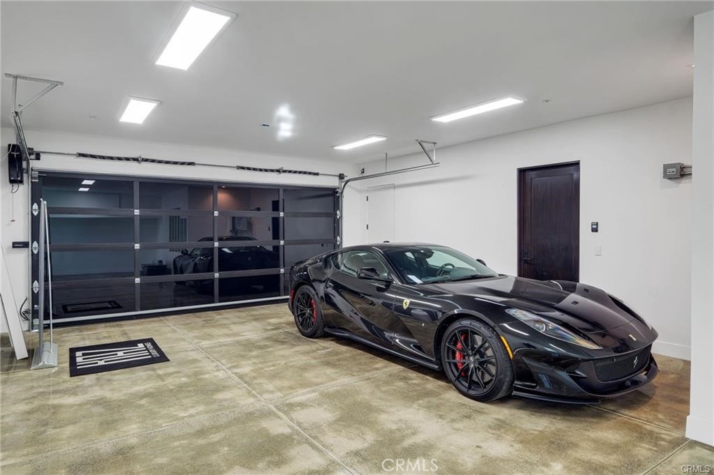 1207 Dolphin Terrace Corona del Mar, CA 92625 - Photo 8 of 58 a car parked in a garage