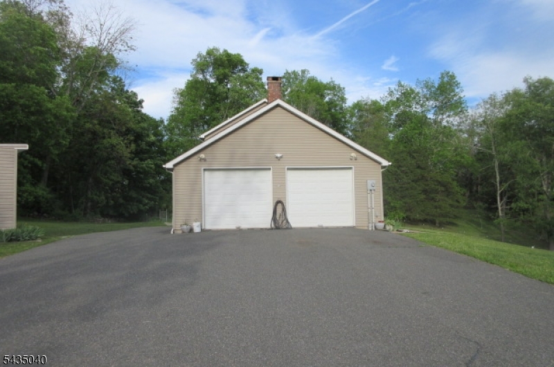 28 Beaver Run Road Lafayette, NJ 07848 - Photo 2 of 36 a view of a house with a yard and large trees