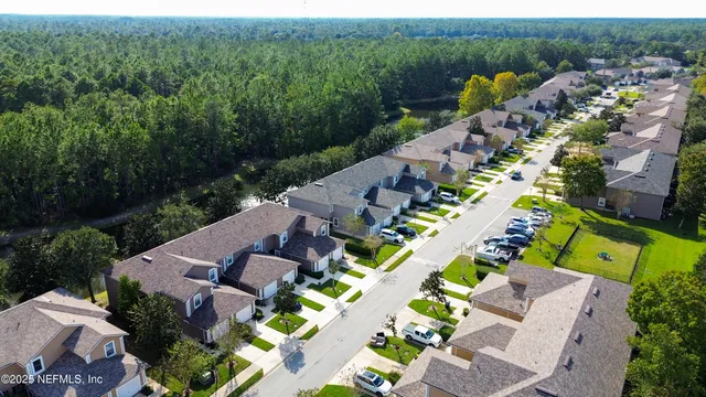 an aerial view of a house with yard swimming pool and outdoor seating