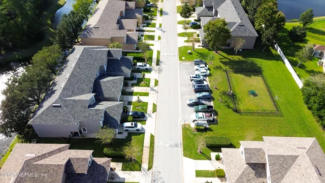 an aerial view of a house with a lake view