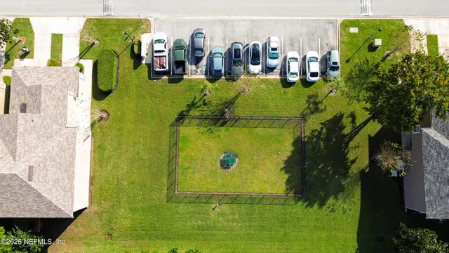 an aerial view of house with swimming pool