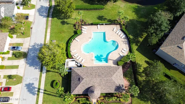 a front view of house with yard outdoor seating and green space