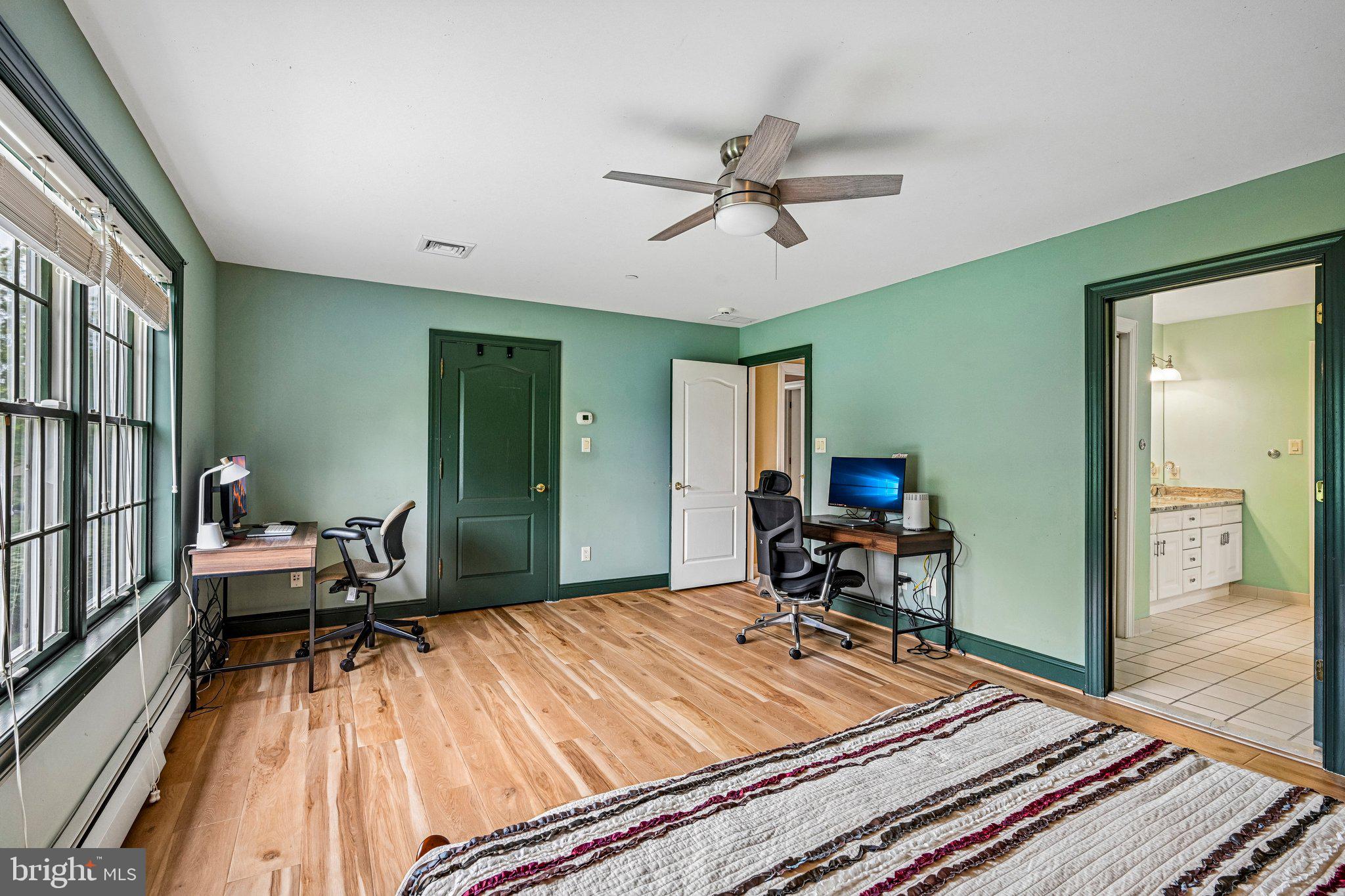 434 Meetinghouse Road Ambler, PA 19002 - Photo 36 of 51 a bedroom with a bed and wooden floor