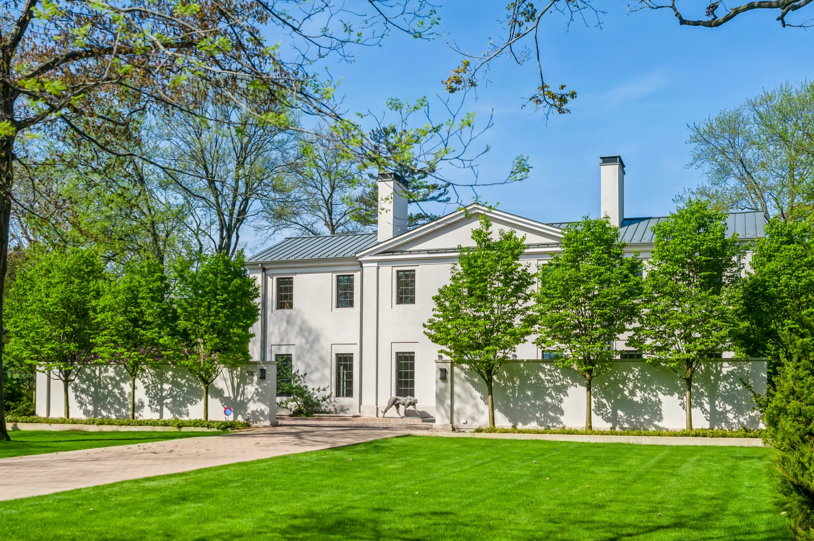 930 Lake Road Lake Forest, IL 60045 - Photo 1 of 51 a front view of a house with a garden