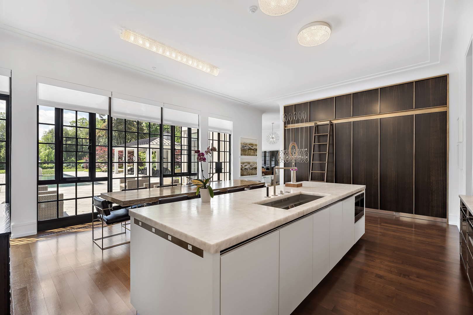 930 Lake Road Lake Forest, IL 60045 - Photo 12 of 51 a living room with stainless steel appliances granite countertop a sink and a wooden floor