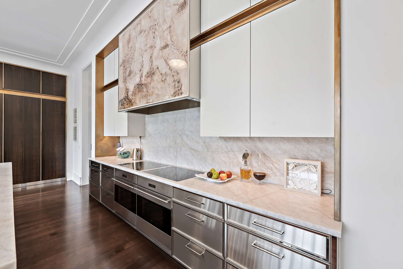 930 Lake Road Lake Forest, IL 60045 - Photo 17 of 51 a kitchen with stainless steel appliances white cabinets and wooden floor
