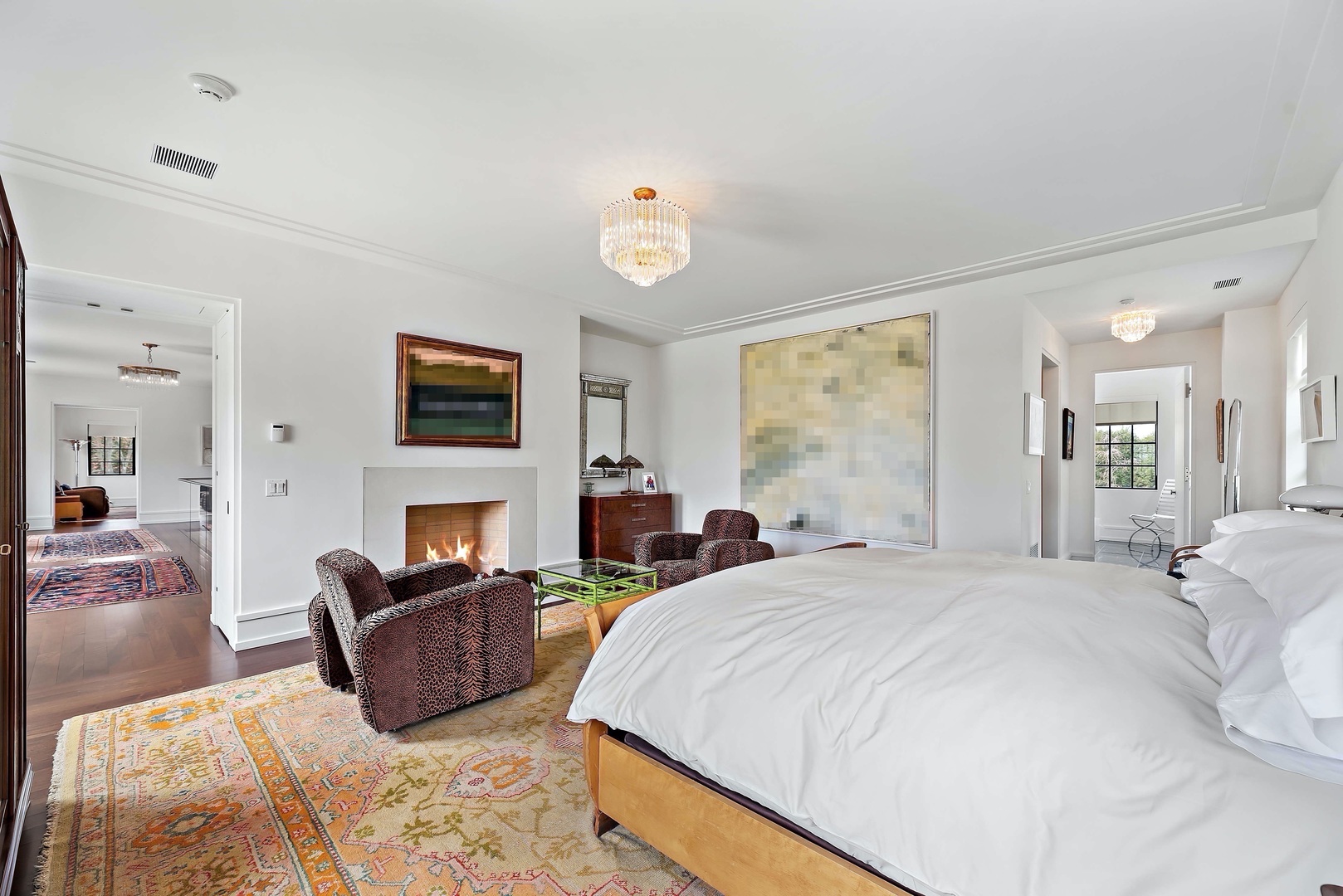 930 Lake Road Lake Forest, IL 60045 - Photo 19 of 51 a spacious bedroom with a bed and a fireplace
