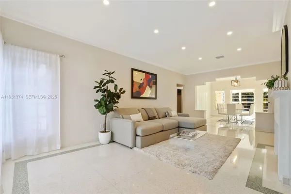 a living room with furniture a chandelier