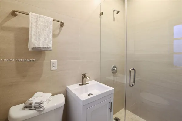 a bathroom with a toilet and a sink