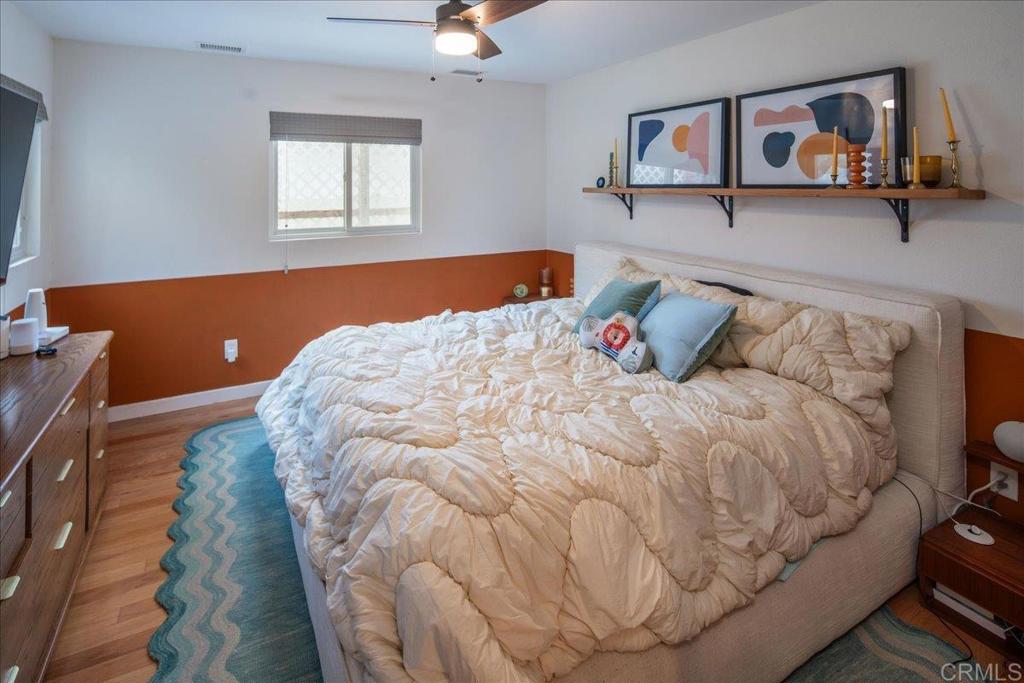 14539 Kennebunk Street Poway, CA 92064 - Photo 16 of 26 a bed sitting in a bedroom next to a window
