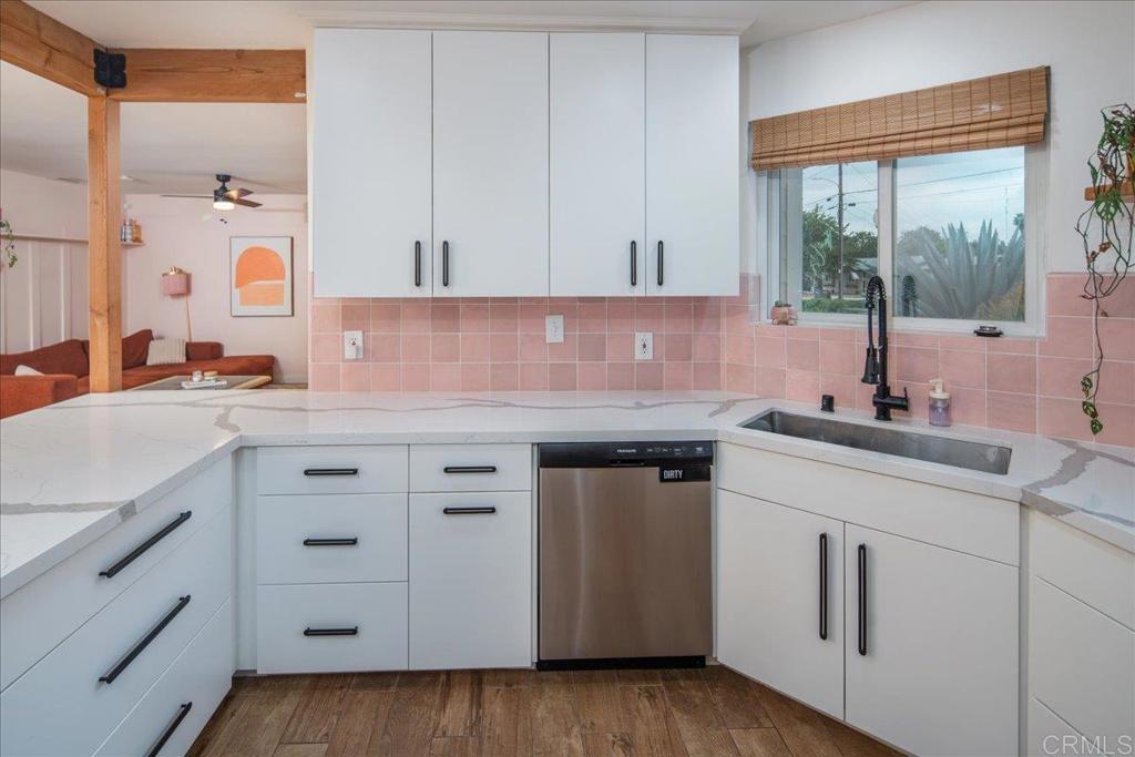 14539 Kennebunk Street Poway, CA 92064 - Photo 8 of 26 a kitchen with cabinets appliances a sink and a window