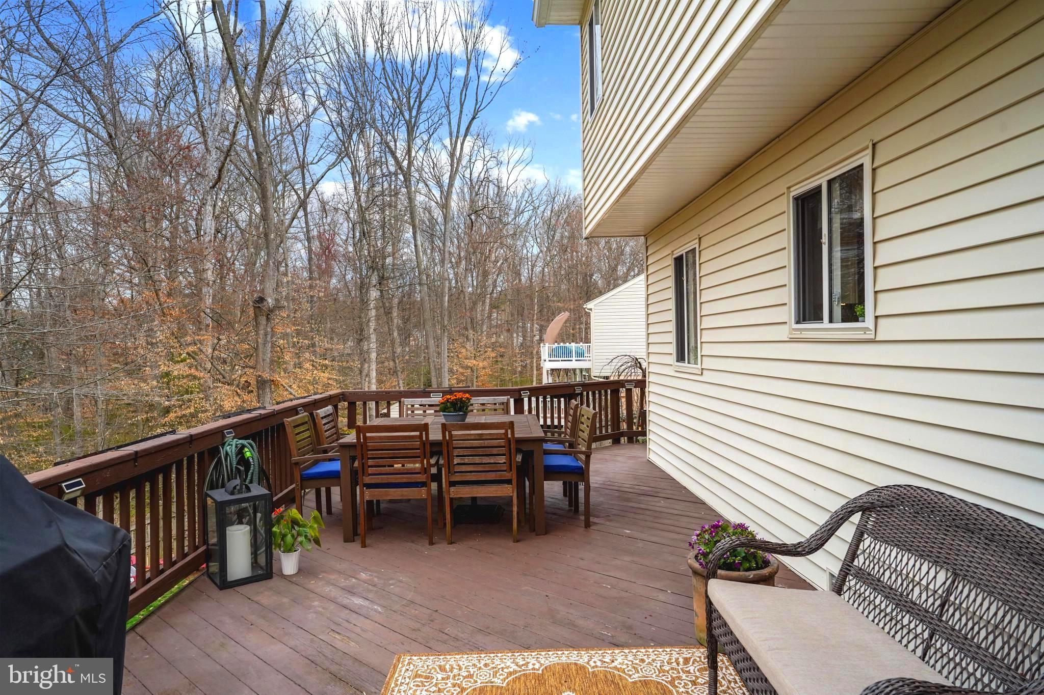 9036 Brook Ford Road Burke, VA 22015 - Photo 16 of 40 a view of a chairs and table in the balcony