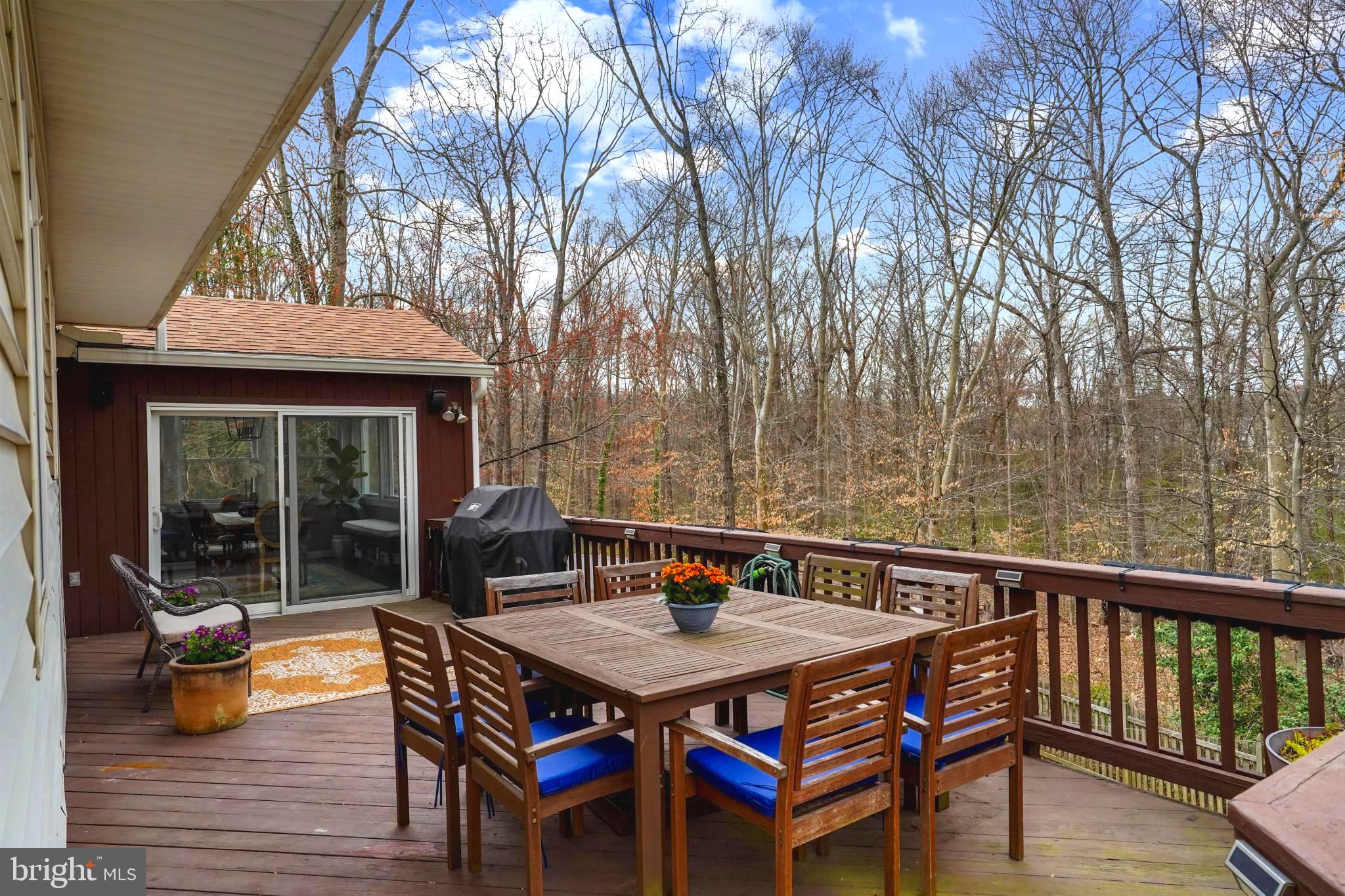 9036 Brook Ford Road Burke, VA 22015 - Photo 17 of 40 a balcony with wooden floor table and chairs