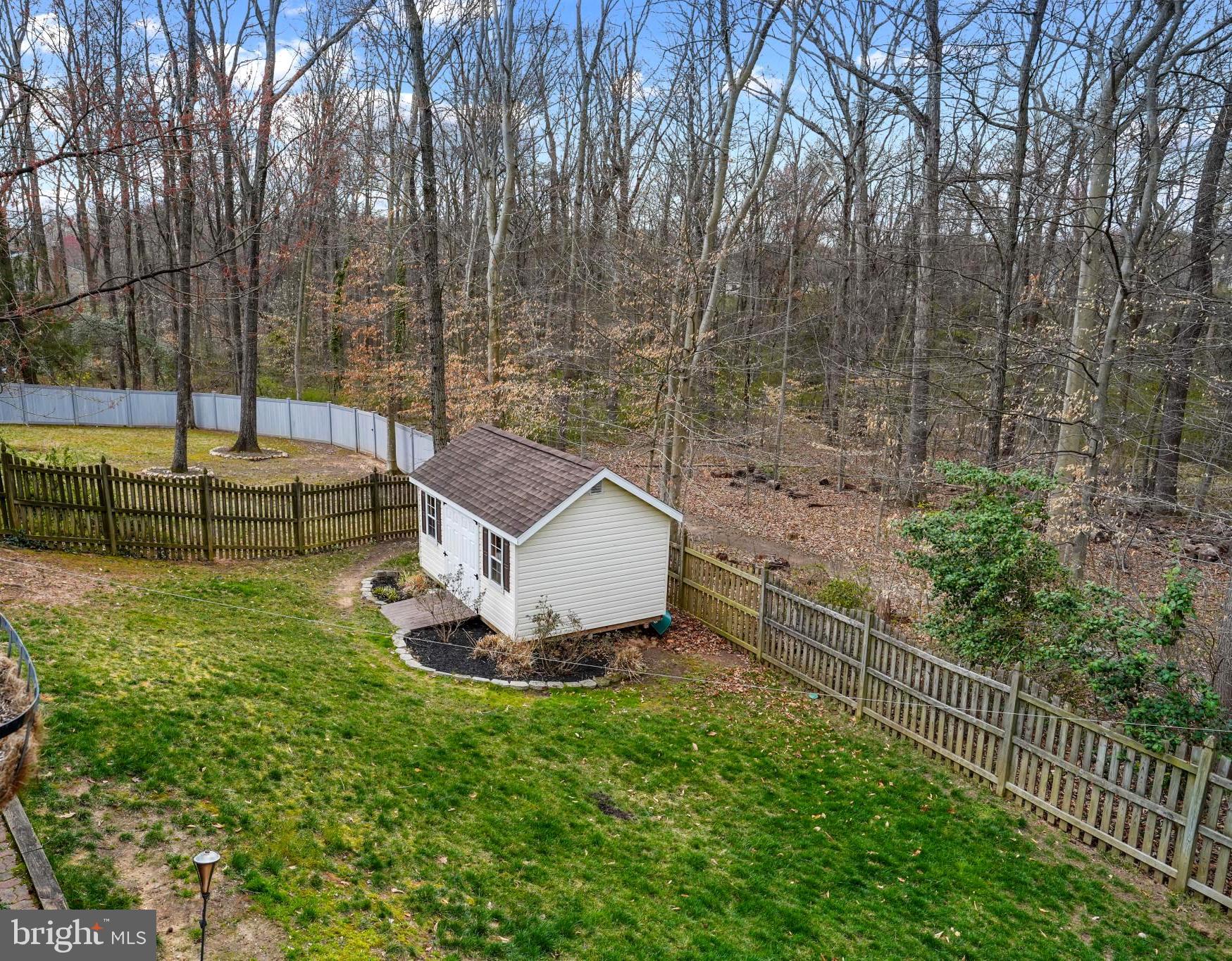 9036 Brook Ford Road Burke, VA 22015 - Photo 18 of 40 a view of a backyard with large trees
