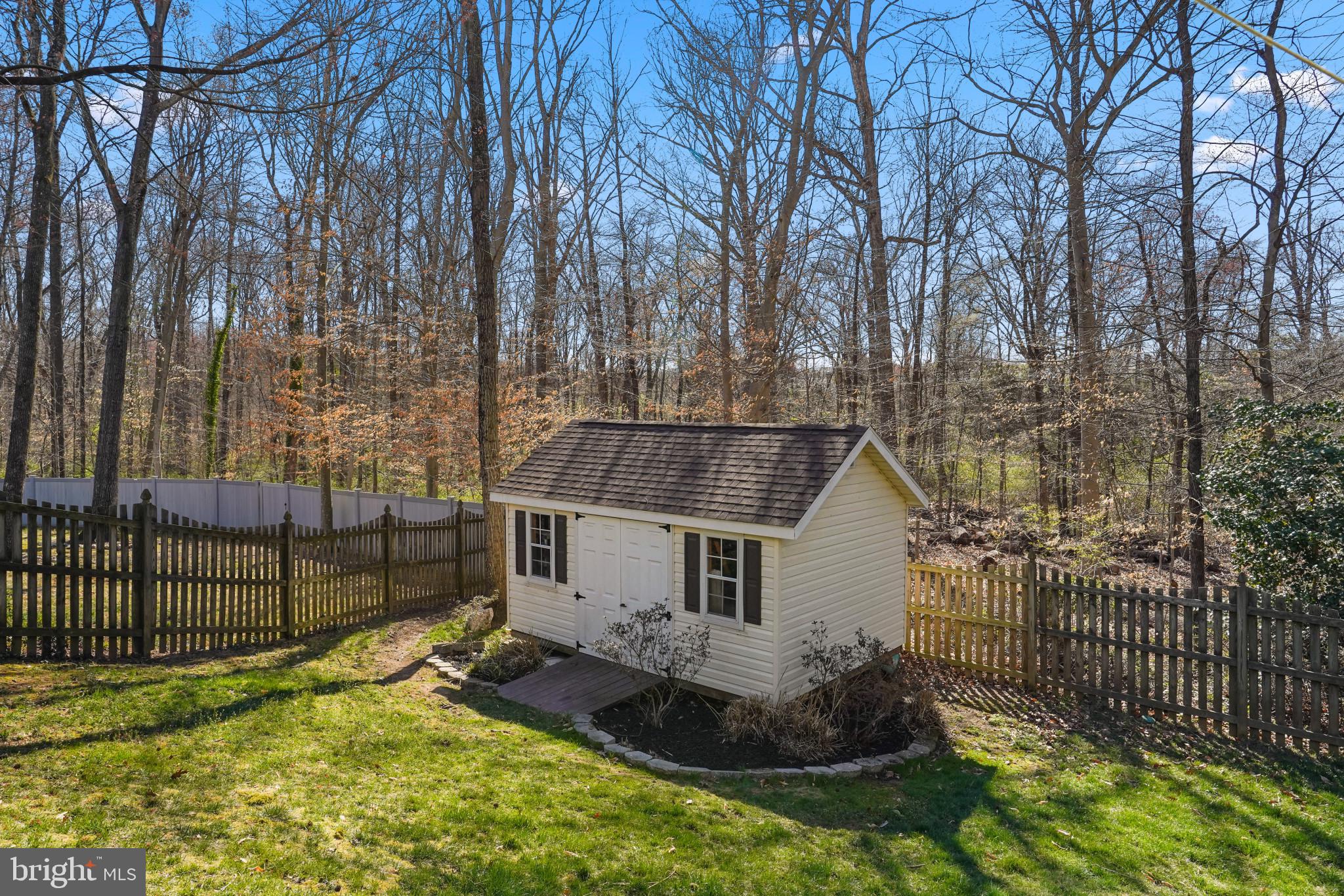 9036 Brook Ford Road Burke, VA 22015 - Photo 19 of 40 a view of house with a yard