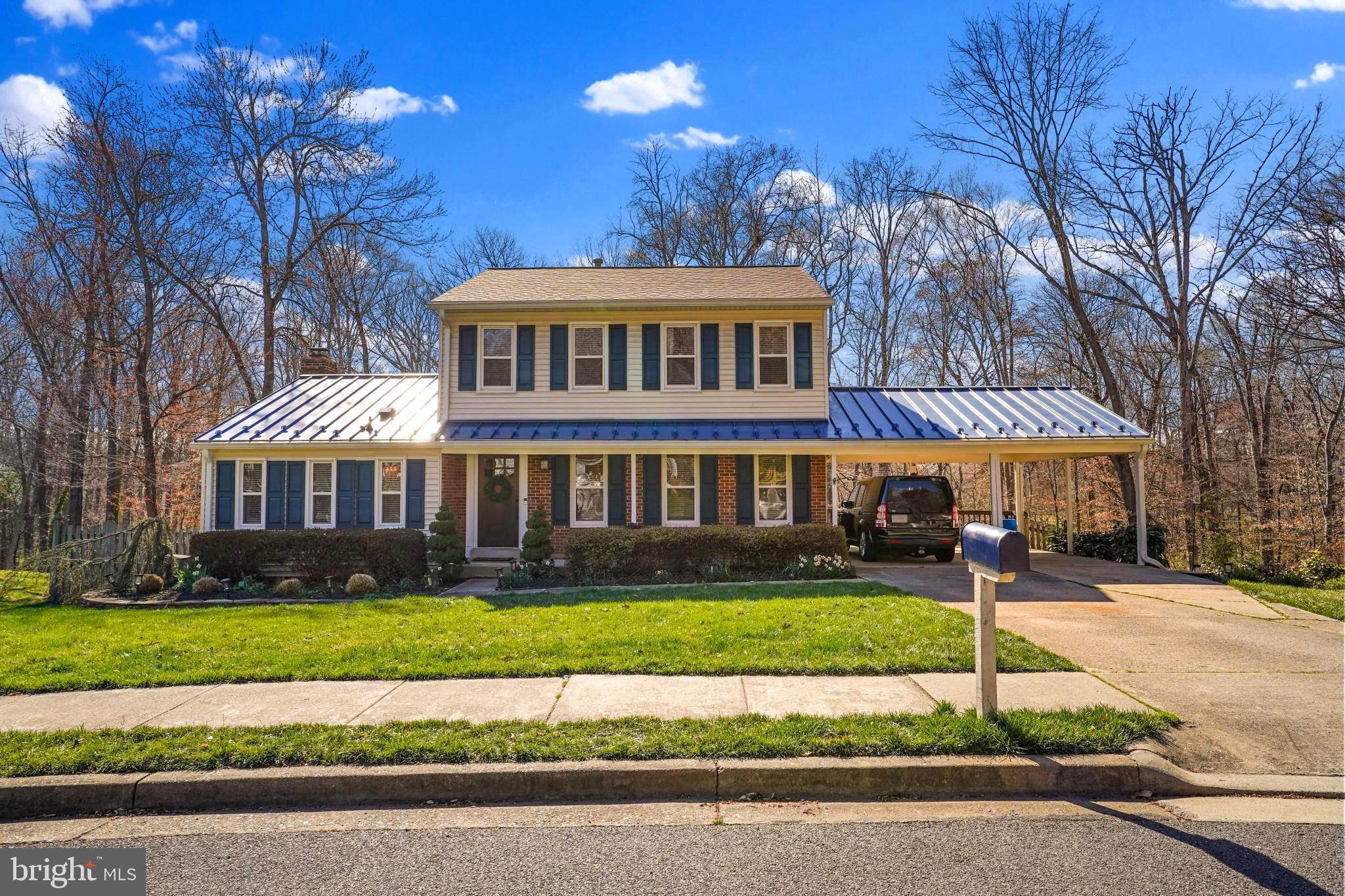 9036 Brook Ford Road Burke, VA 22015 - Photo 2 of 40 a front view of a house with a yard