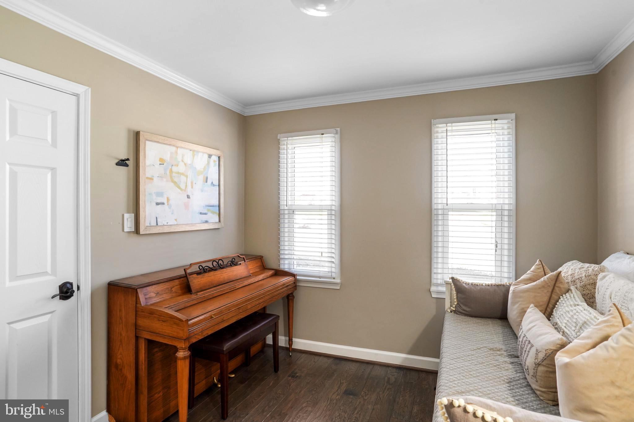9036 Brook Ford Road Burke, VA 22015 - Photo 22 of 40 a bedroom with furniture and a window