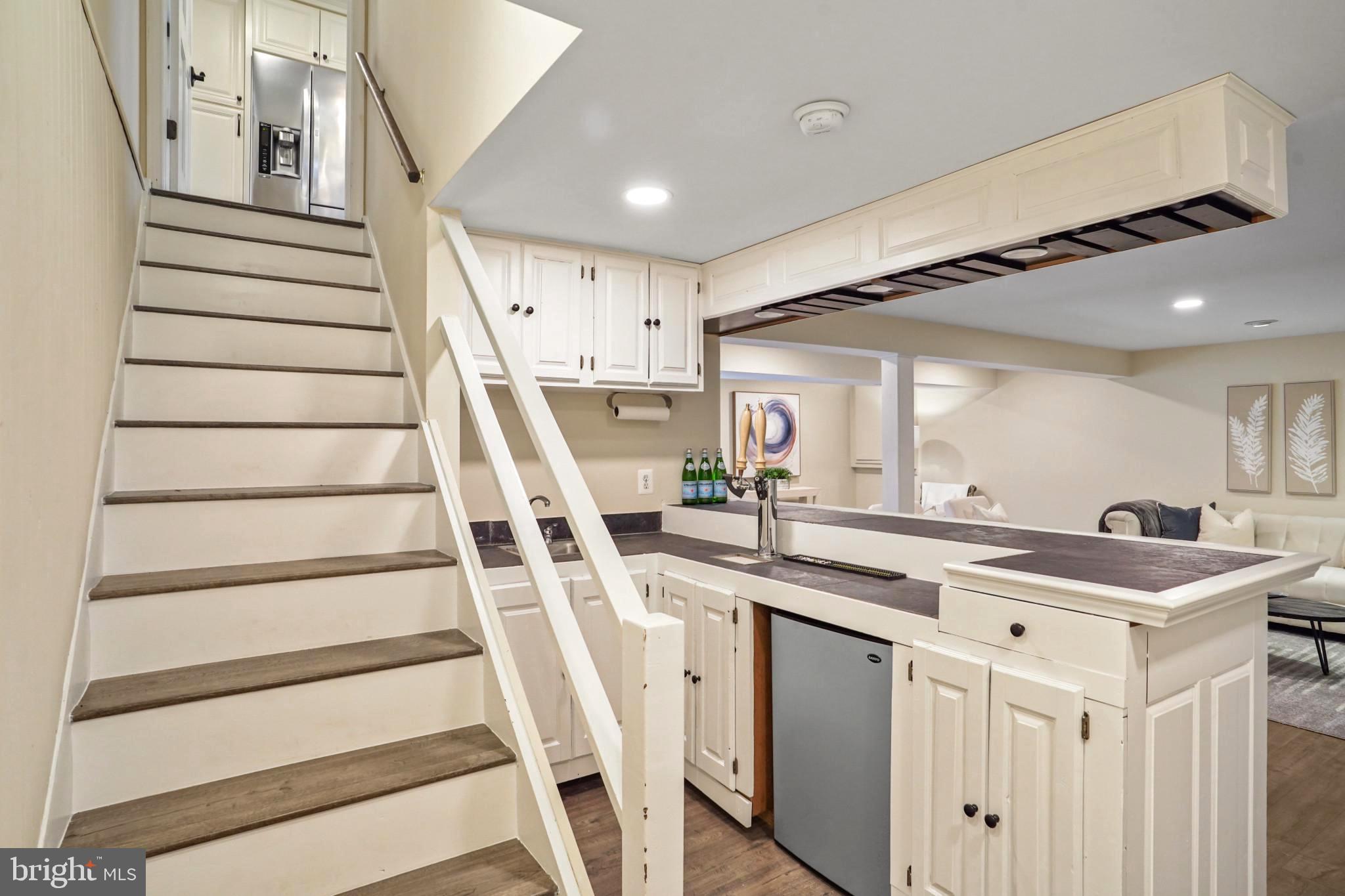 9036 Brook Ford Road Burke, VA 22015 - Photo 32 of 40 a kitchen with white cabinets and sink