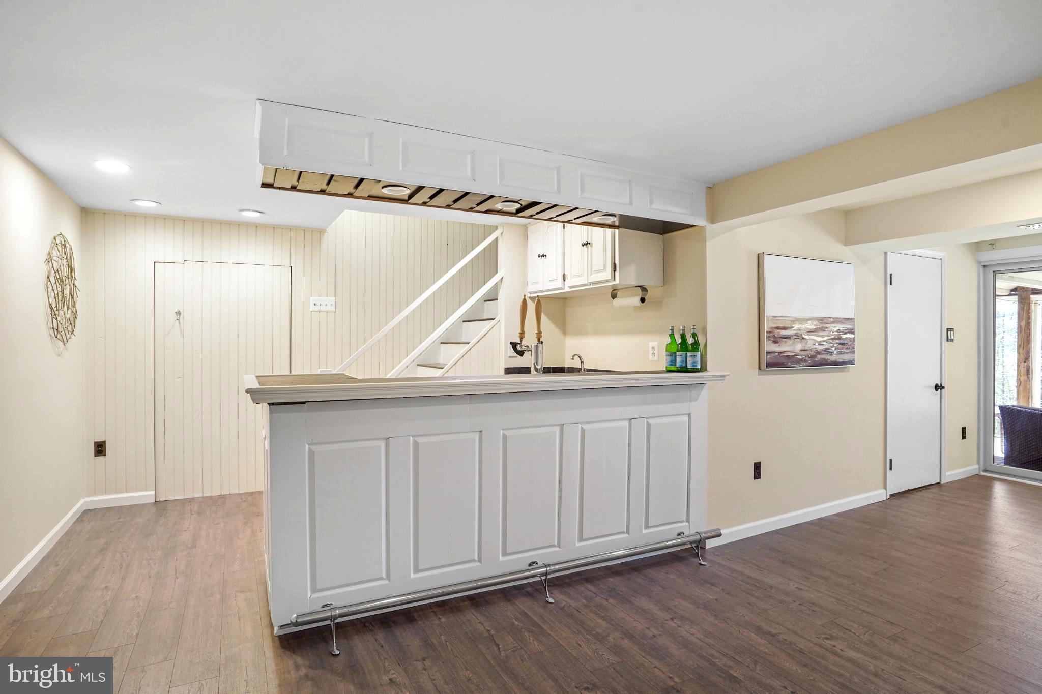 9036 Brook Ford Road Burke, VA 22015 - Photo 33 of 40 a view of a hallway with wooden floor