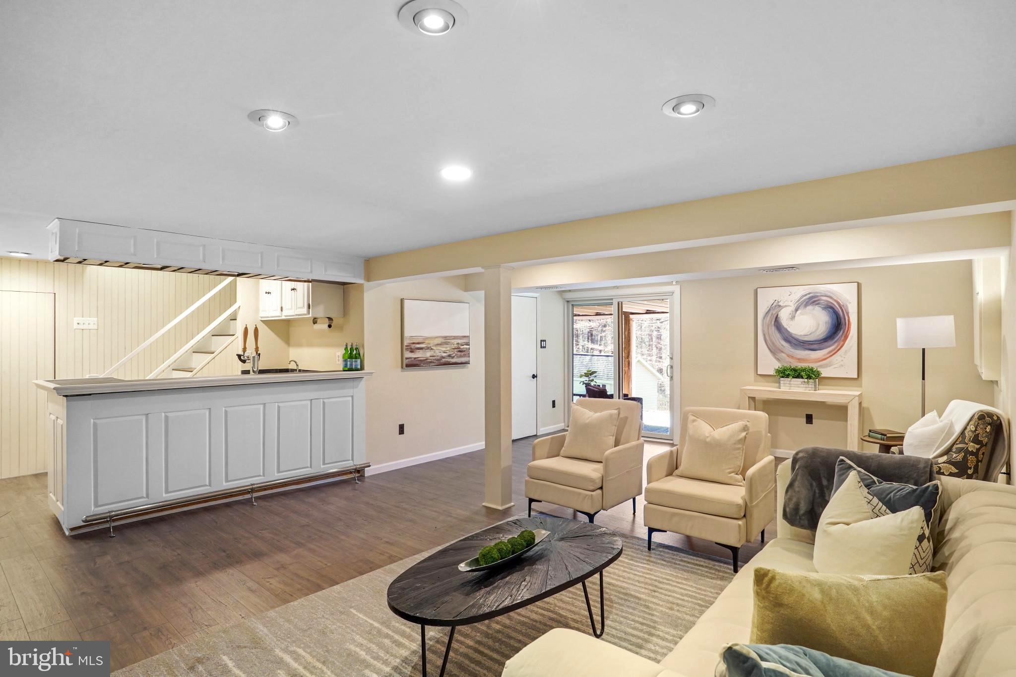 9036 Brook Ford Road Burke, VA 22015 - Photo 35 of 40 a living room with furniture and a wooden floor