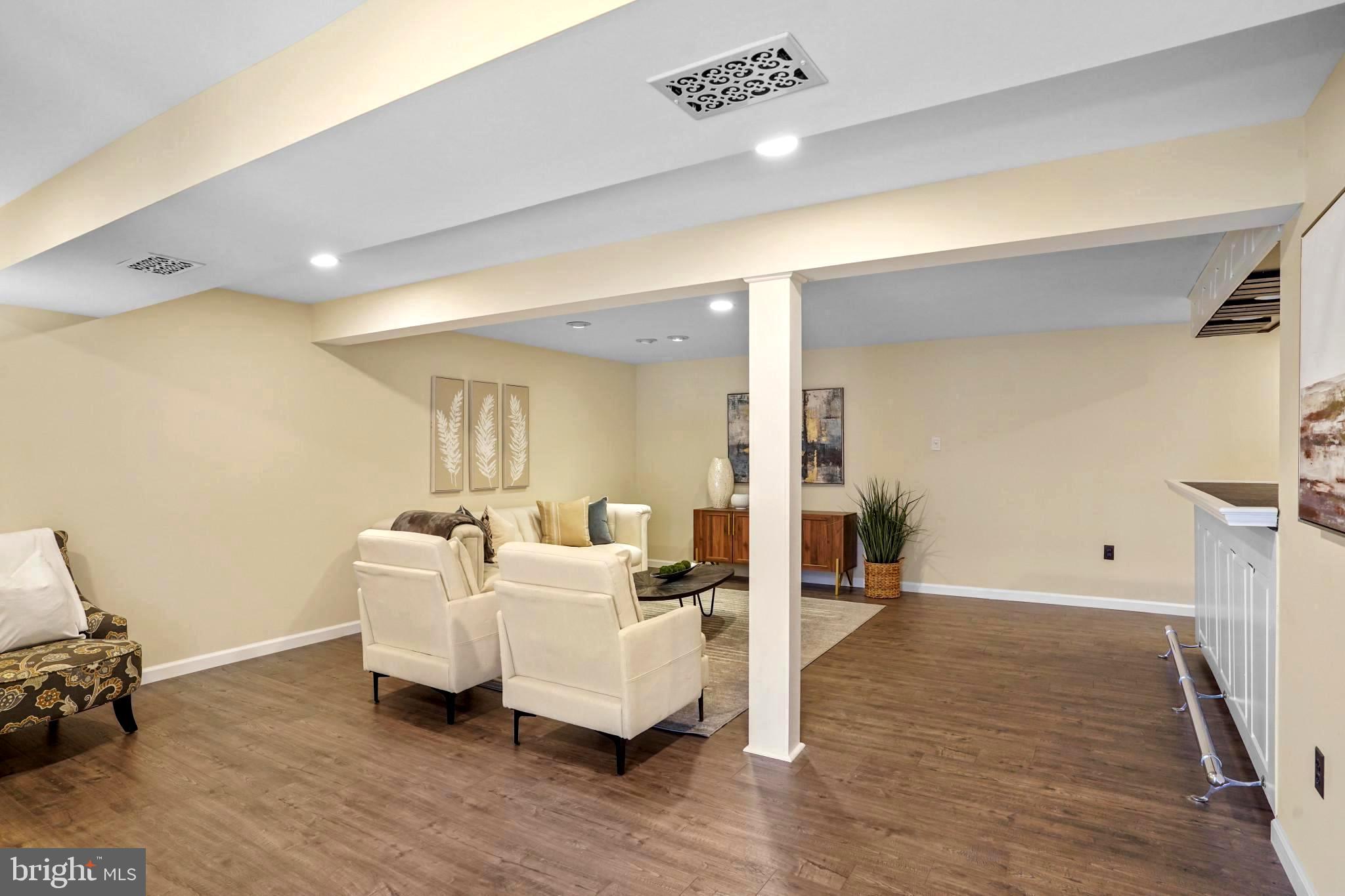 9036 Brook Ford Road Burke, VA 22015 - Photo 36 of 40 a living room with furniture and wooden floor