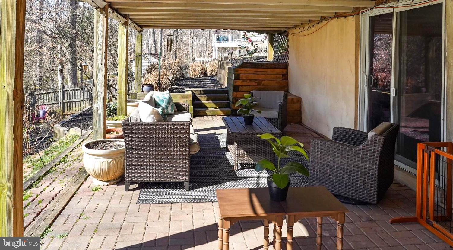 9036 Brook Ford Road Burke, VA 22015 - Photo 37 of 40 a living room with furniture and a floor to ceiling window