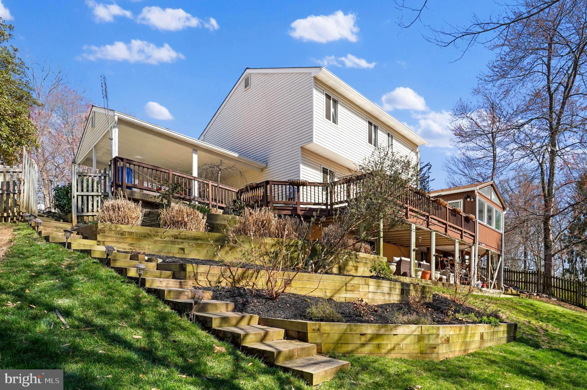 9036 Brook Ford Road Burke, VA 22015 - Photo 39 of 40 a view of a large white building in front of a house