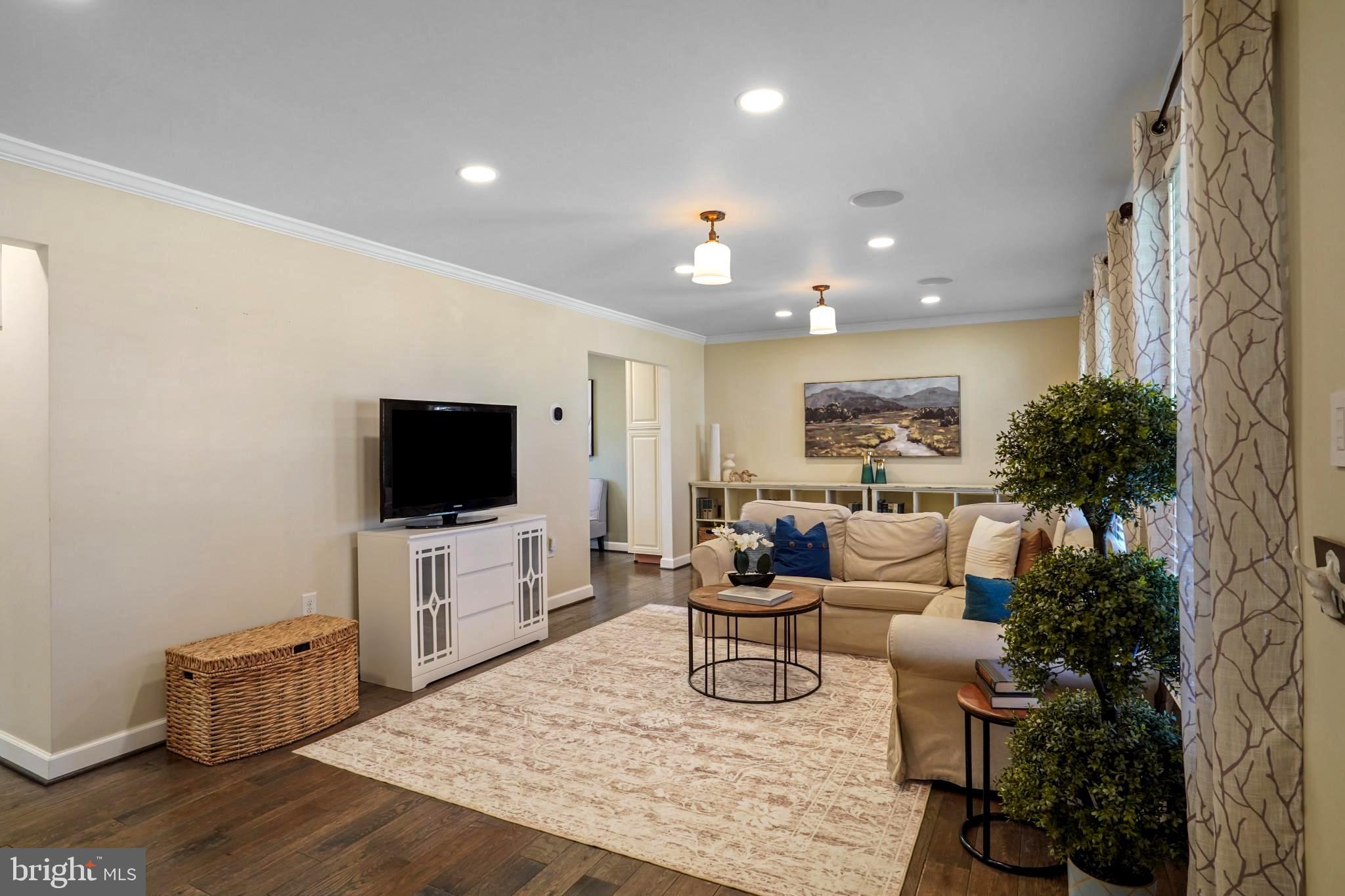 9036 Brook Ford Road Burke, VA 22015 - Photo 6 of 40 a living room with furniture and a flat screen tv