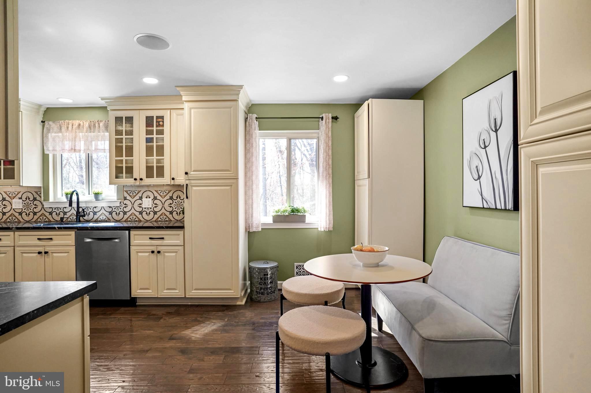 9036 Brook Ford Road Burke, VA 22015 - Photo 7 of 40 a living room with stainless steel appliances granite countertop furniture a chandelier and a window