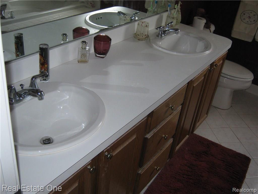 23880 Hall Road Trenton, MI 48183 - Photo 36 of 50 Large Master bathroom-dual vanities -walk in shower with jetted tub