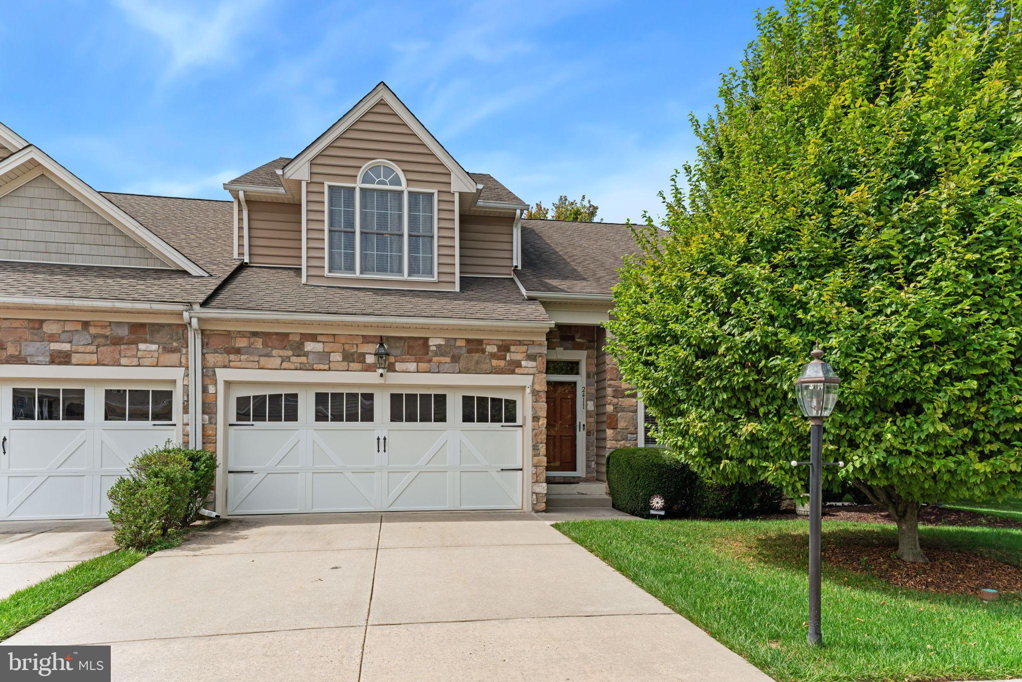 2411 Grand Oaks Court, Unit 30 Abingdon, MD 21009 - Photo 1 of 45 a front view of a house with a yard