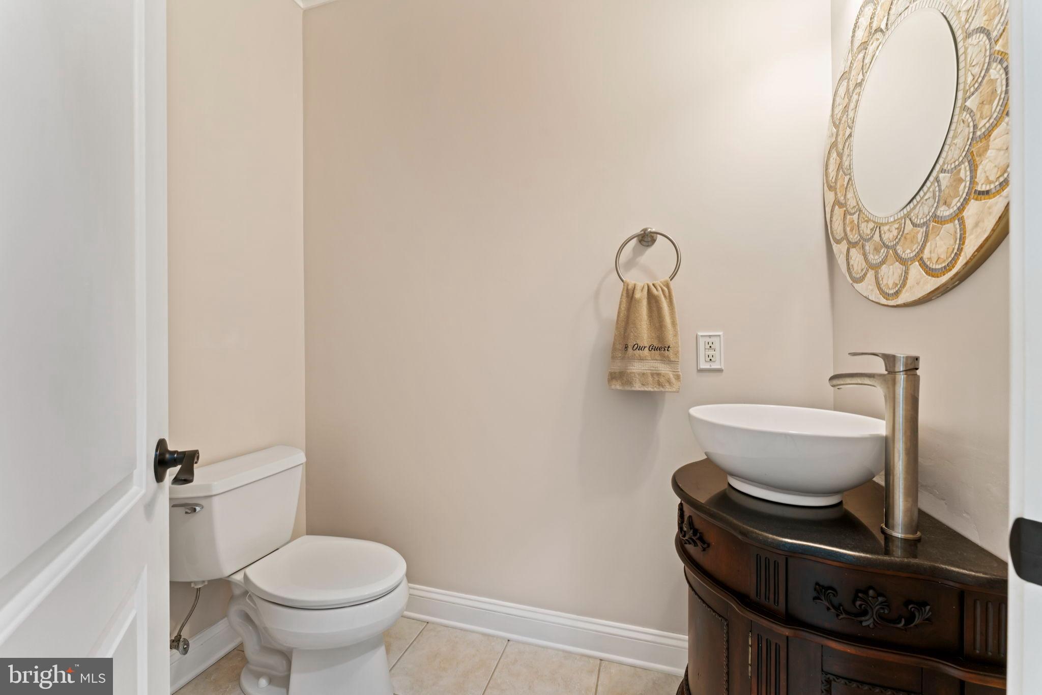 2411 Grand Oaks Court, Unit 30 Abingdon, MD 21009 - Photo 15 of 45 a bathroom with a toilet and a mirror