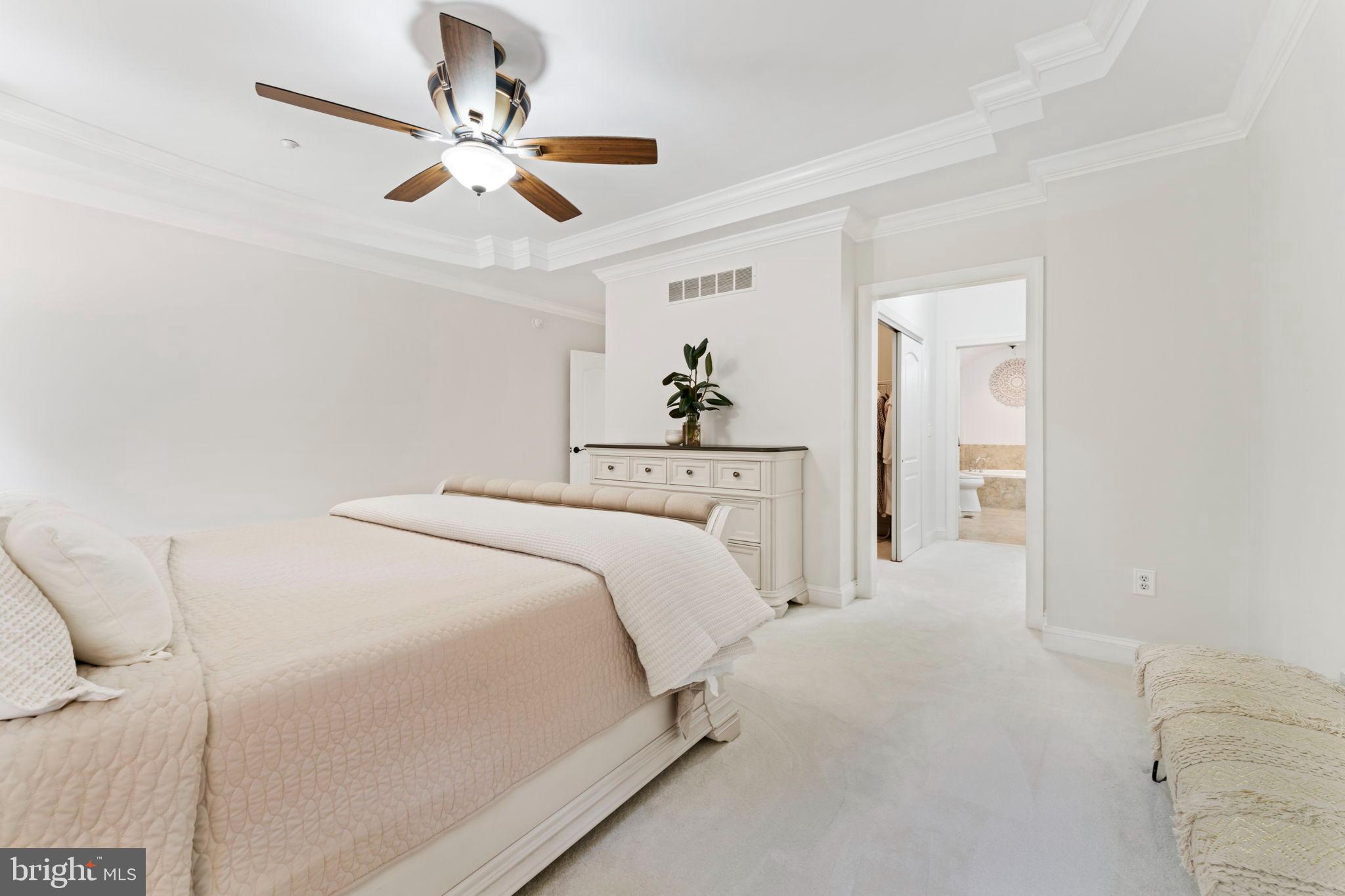 2411 Grand Oaks Court, Unit 30 Abingdon, MD 21009 - Photo 18 of 45 a bedroom with a bed and a chandelier