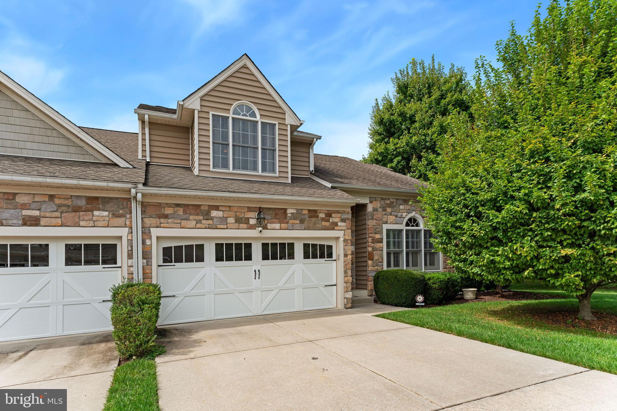 2411 Grand Oaks Court, Unit 30 Abingdon, MD 21009 - Photo 2 of 45 a front view of a house with a yard