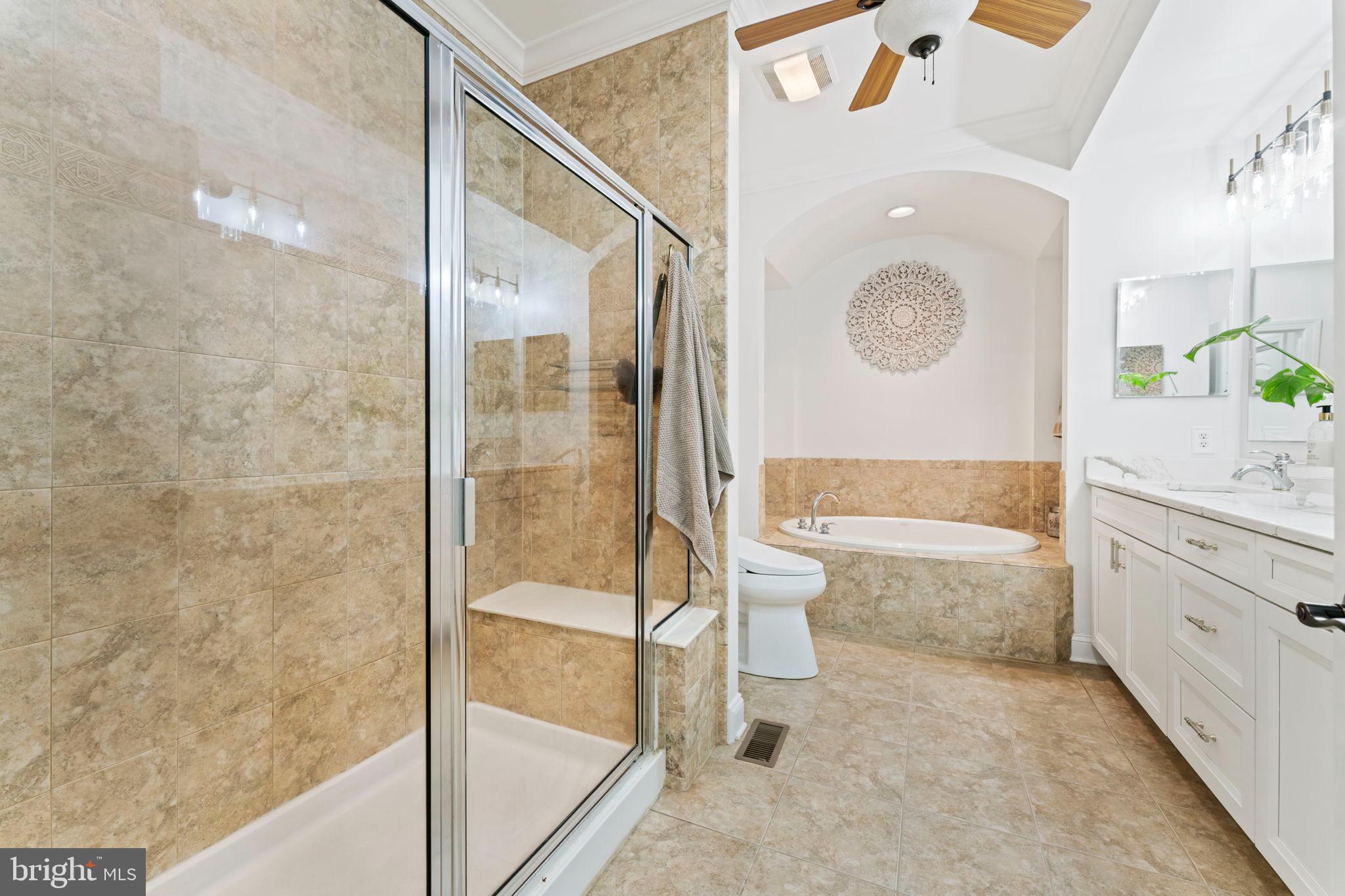 2411 Grand Oaks Court, Unit 30 Abingdon, MD 21009 - Photo 21 of 45 a bathroom with a granite countertop sink mirror bathtub and toilet