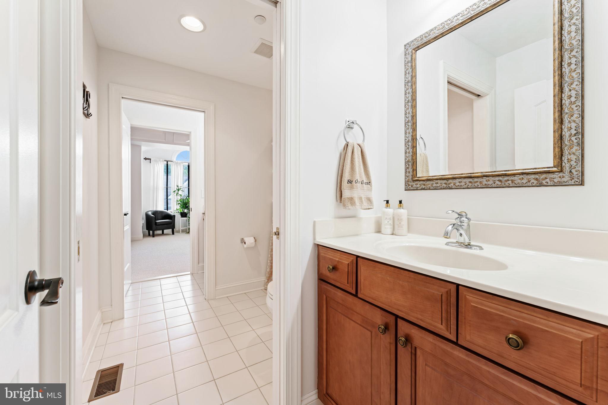 2411 Grand Oaks Court, Unit 30 Abingdon, MD 21009 - Photo 26 of 45 a bathroom with a sink a vanity and a mirror