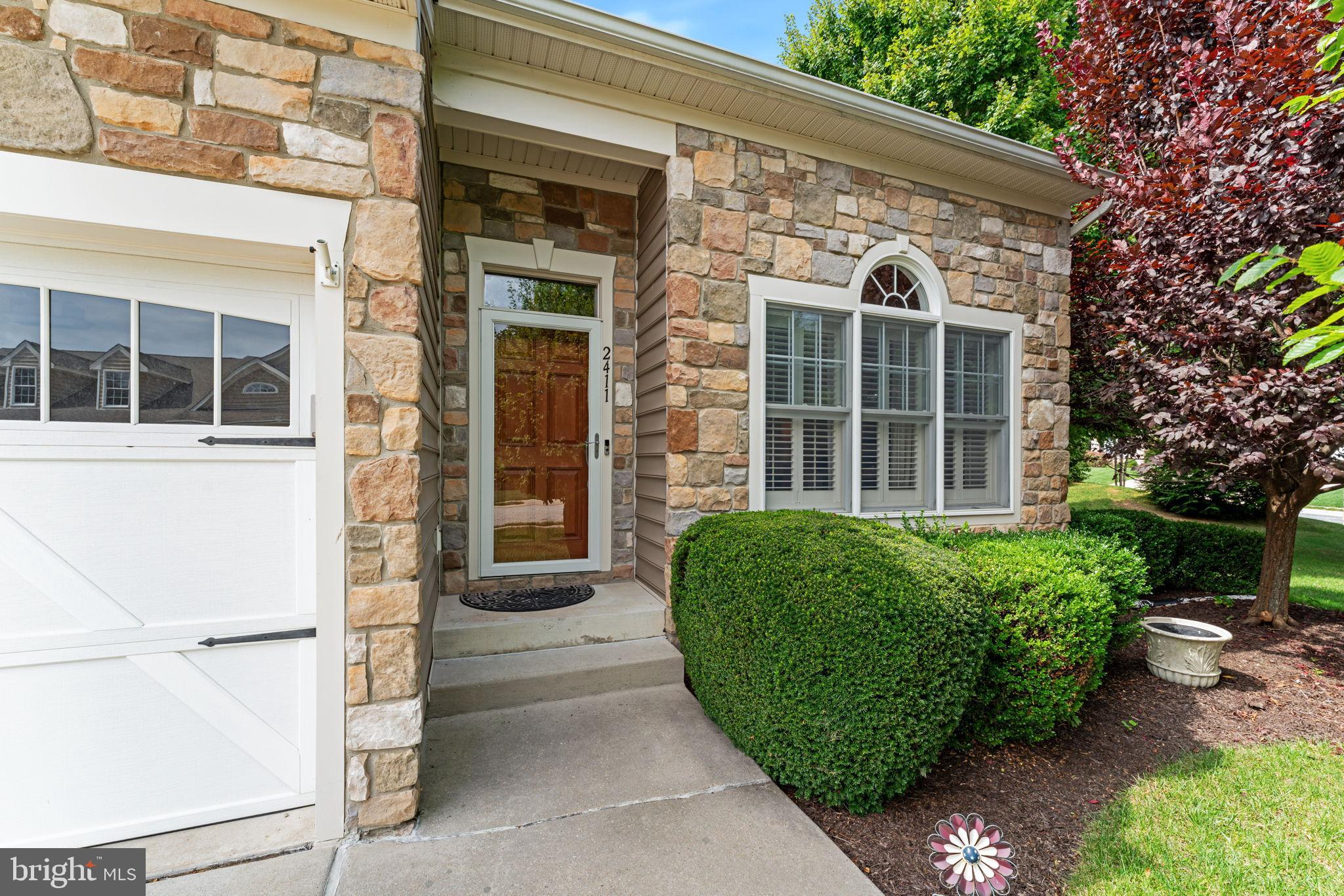 2411 Grand Oaks Court, Unit 30 Abingdon, MD 21009 - Photo 3 of 45 a view of a house with a garden