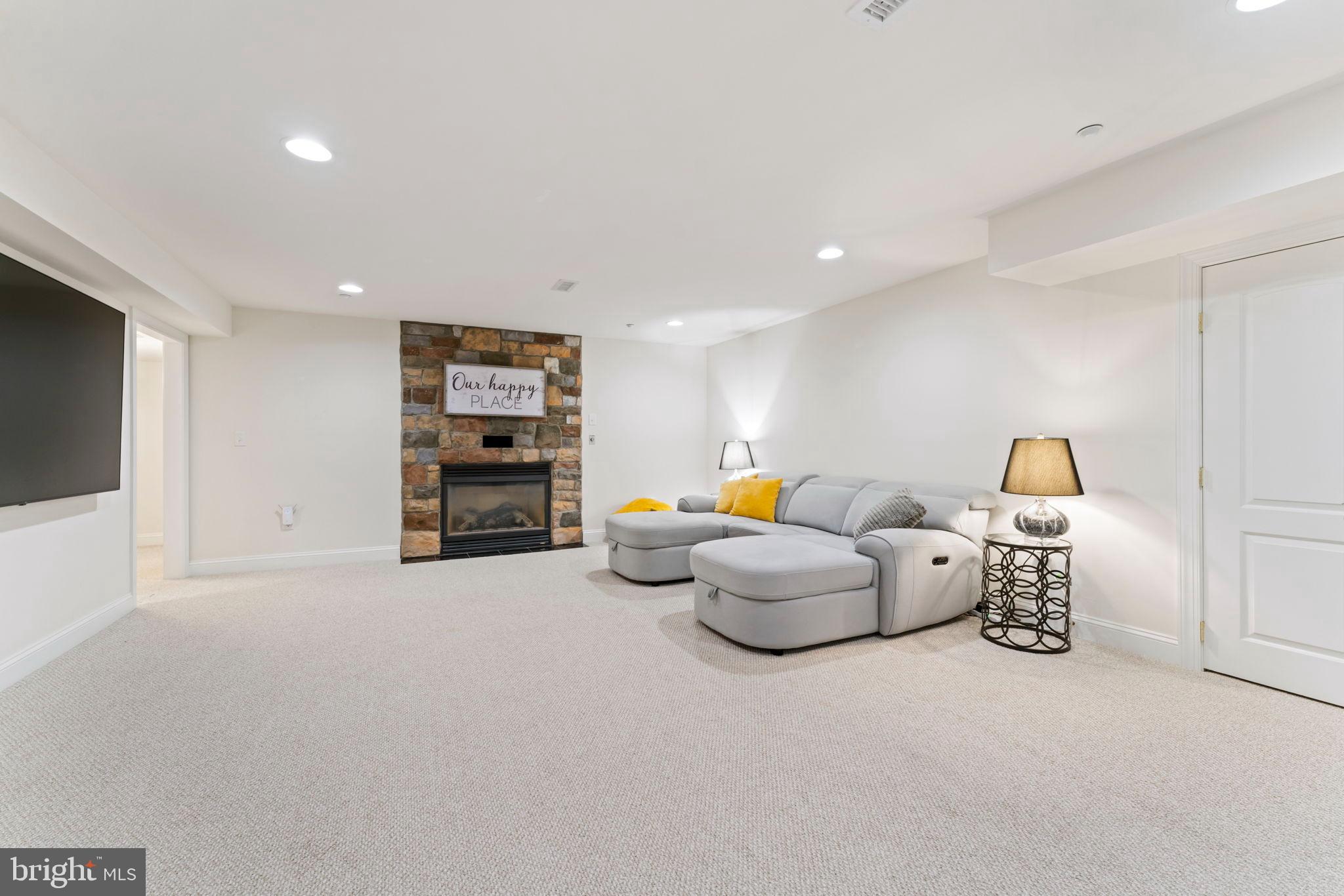 2411 Grand Oaks Court, Unit 30 Abingdon, MD 21009 - Photo 31 of 45 a living room with furniture and a flat screen tv