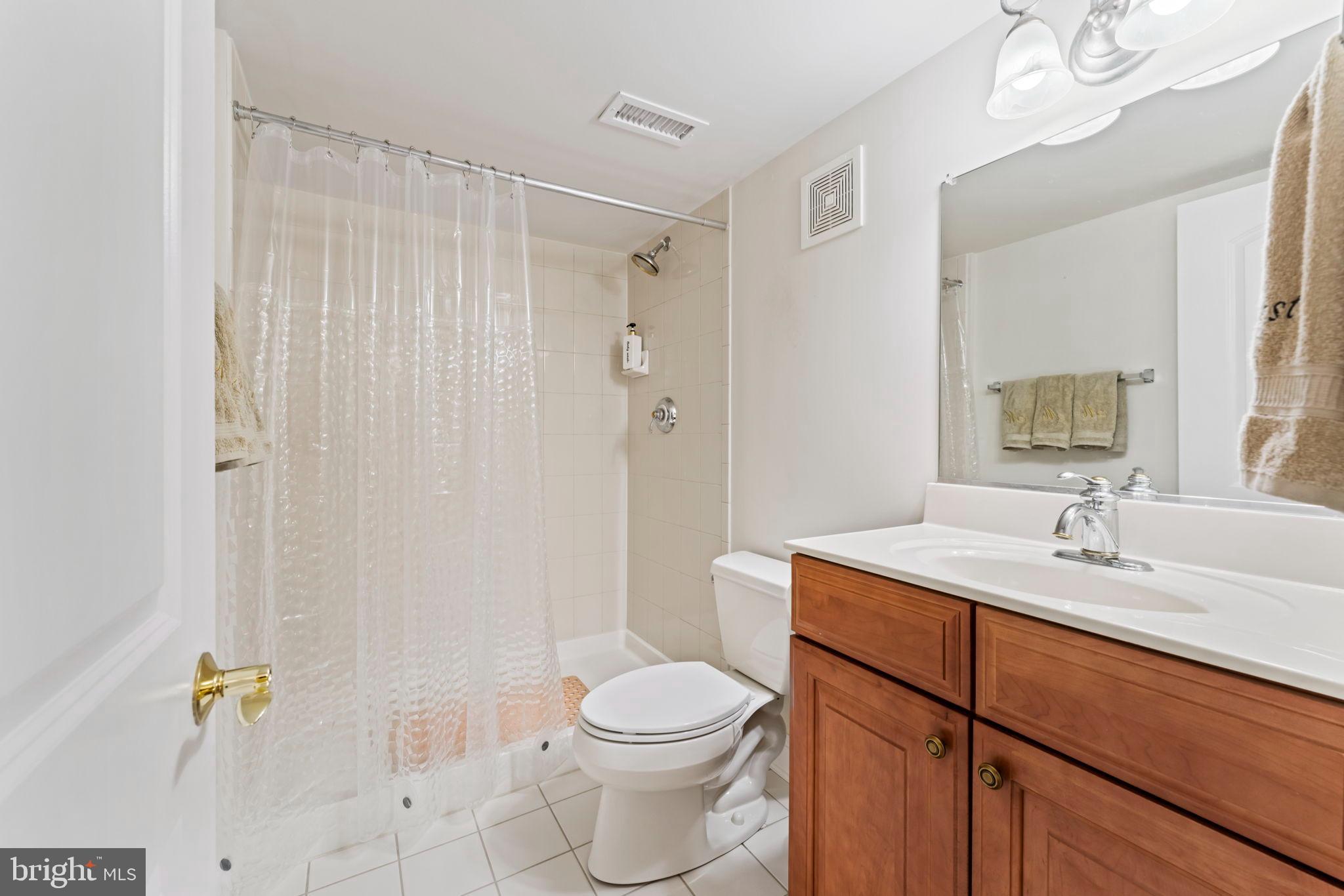 2411 Grand Oaks Court, Unit 30 Abingdon, MD 21009 - Photo 34 of 45 a bathroom with a sink a toilet and shower