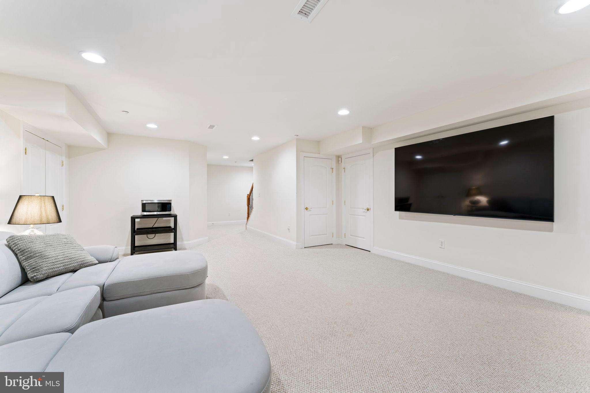 2411 Grand Oaks Court, Unit 30 Abingdon, MD 21009 - Photo 35 of 45 a living room with furniture and a flat screen tv