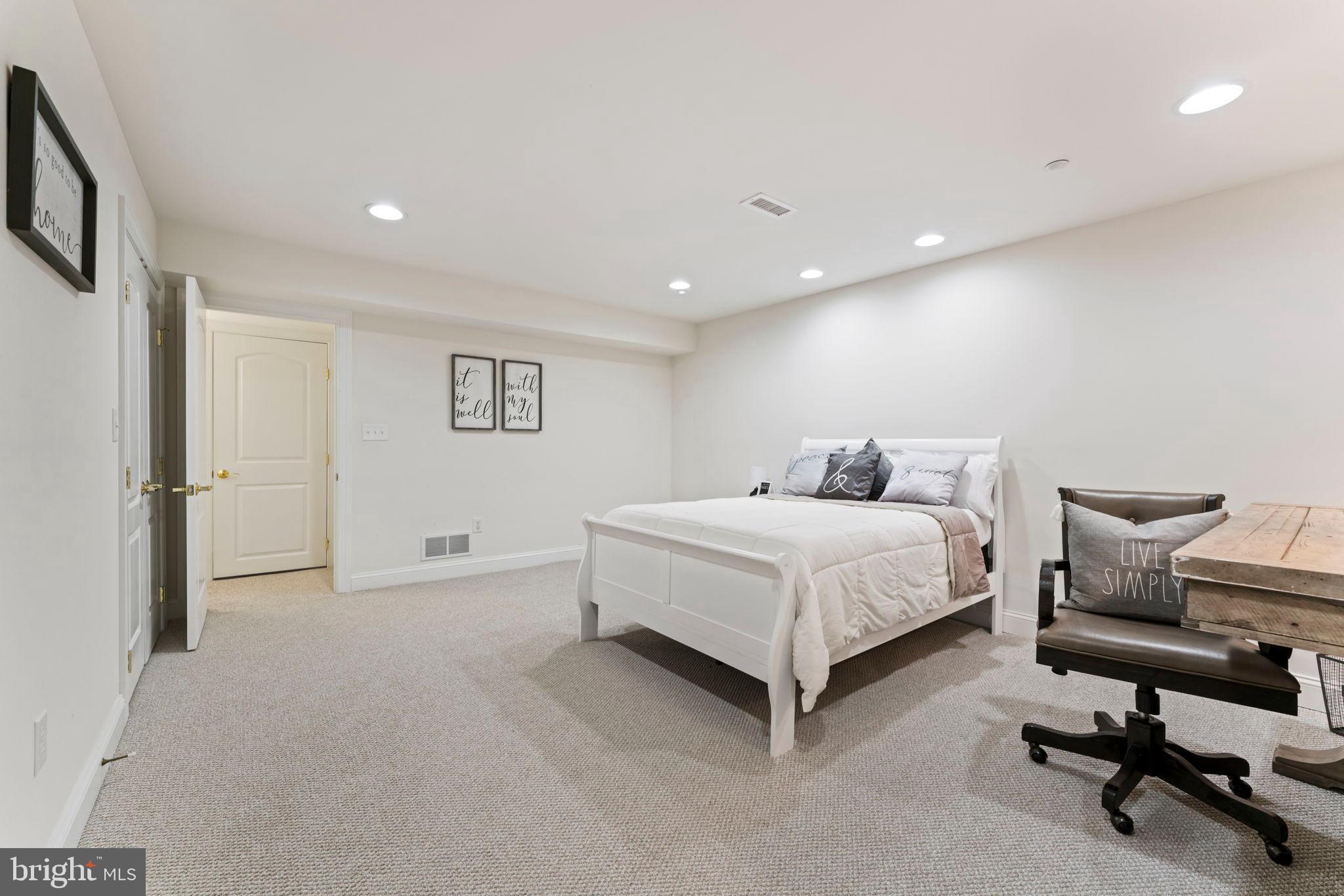 2411 Grand Oaks Court, Unit 30 Abingdon, MD 21009 - Photo 36 of 45 a bedroom with a bed and a chair