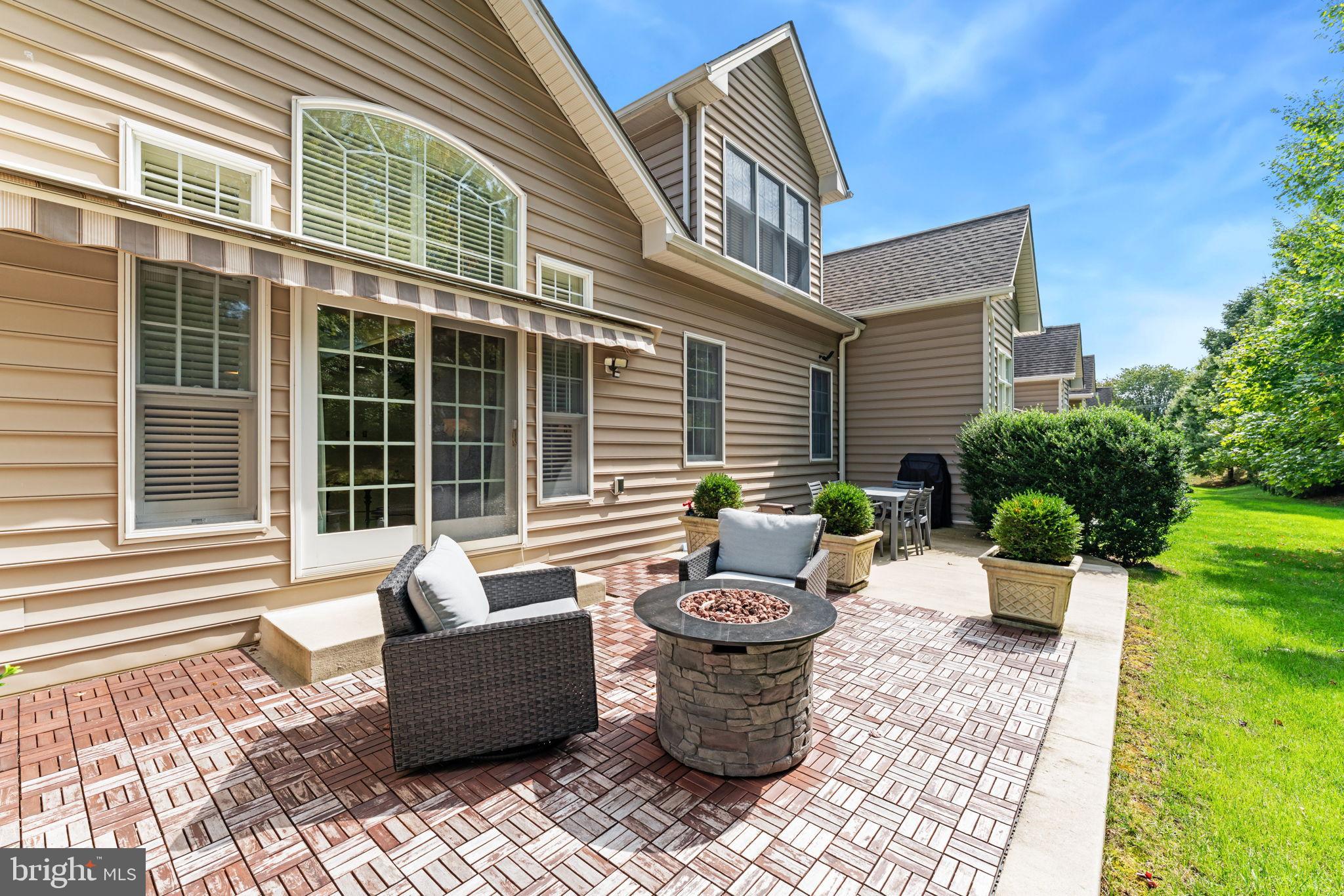 2411 Grand Oaks Court, Unit 30 Abingdon, MD 21009 - Photo 38 of 45 a view of a house with backyard sitting area and garden
