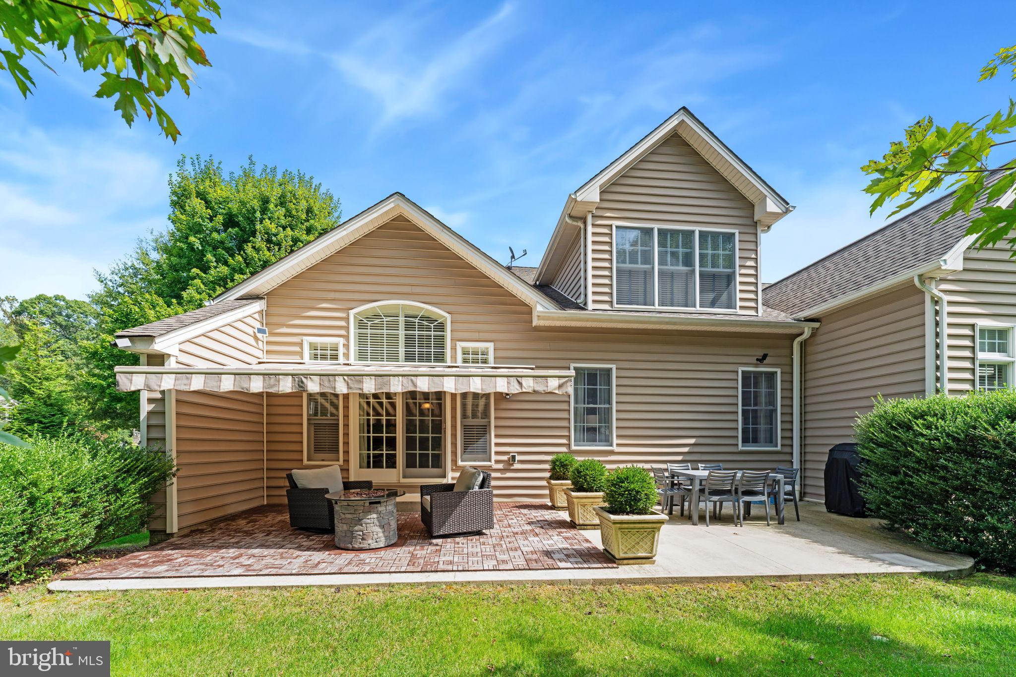 2411 Grand Oaks Court, Unit 30 Abingdon, MD 21009 - Photo 42 of 45 a front view of a house with yard and outdoor seating