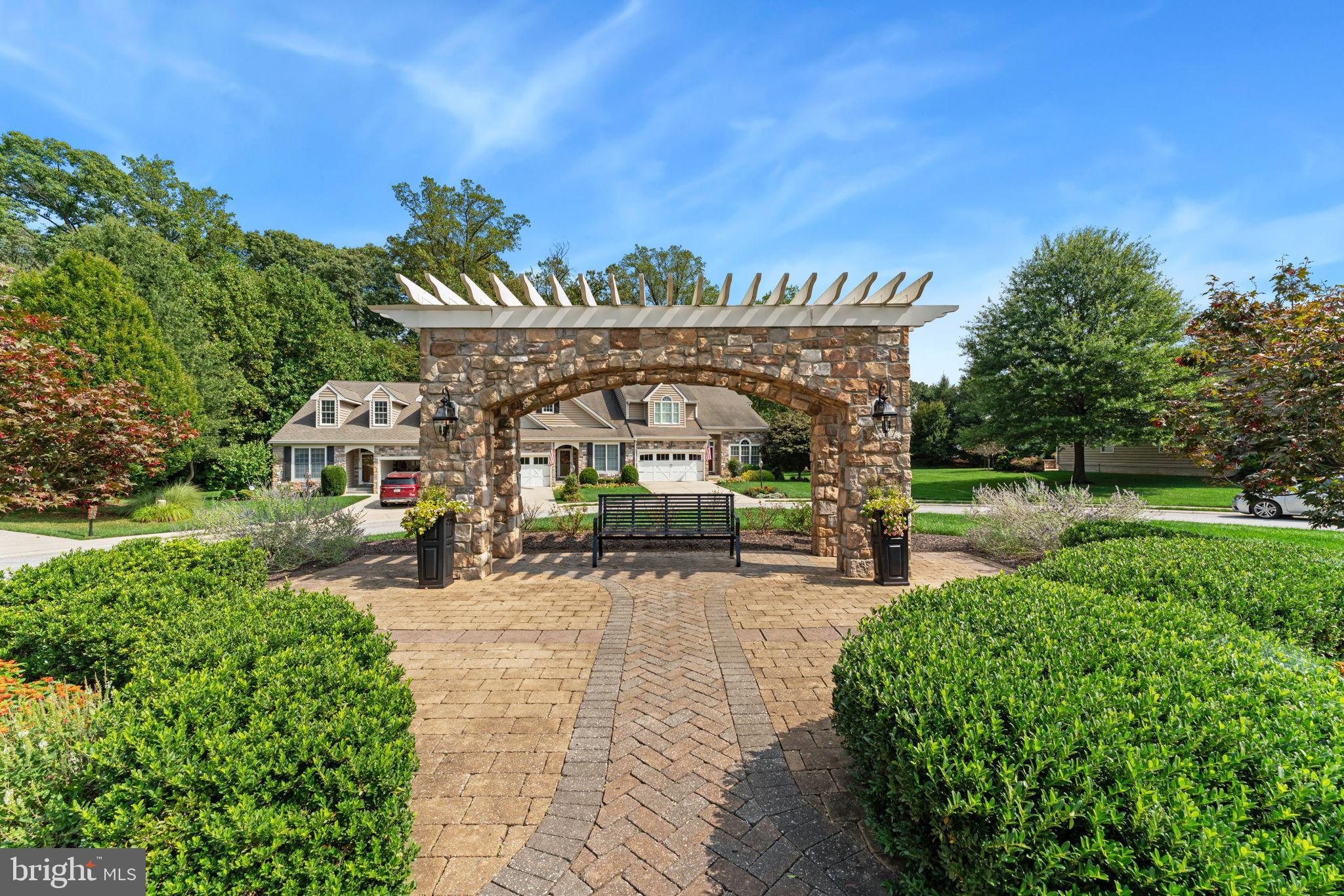 2411 Grand Oaks Court, Unit 30 Abingdon, MD 21009 - Photo 44 of 45 a view of a patio with table and chairs and potted plants