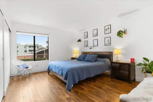 a bedroom with a bed and a table