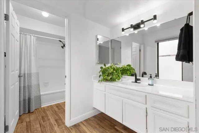 a bathroom with a bathtub and shower