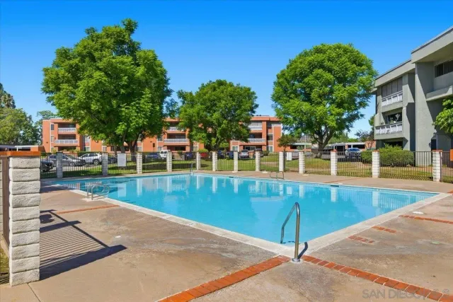 a couple of cars parked in front of a brick building