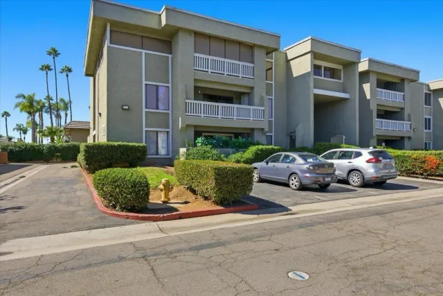 an aerial view of a house with swimming pool and furniture