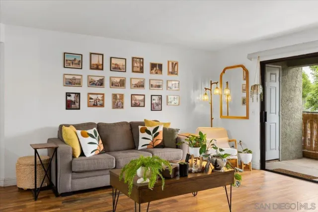 a kitchen with a granite countertop sink and natural light